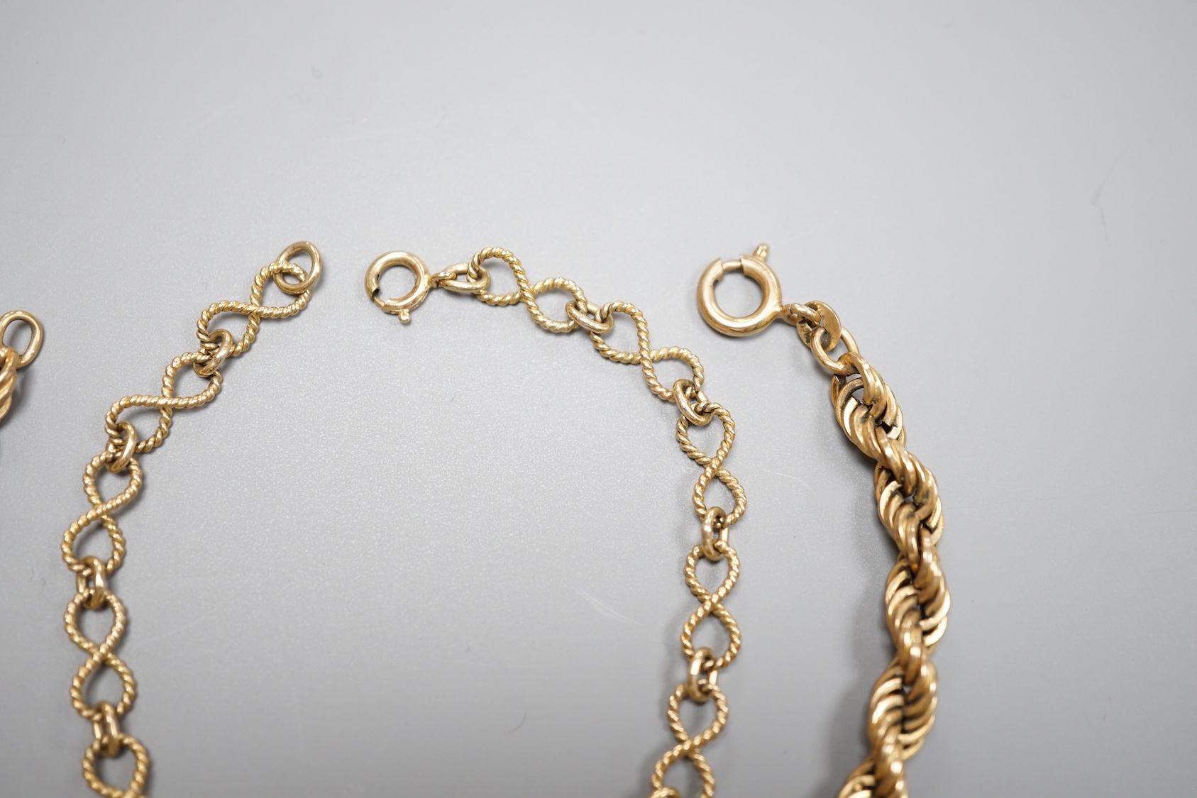 A modern 9ct fancy link bracelet, 18cm and a 9k rope twist bracelet, 21cm, 12.9 grams.